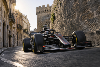 Low angle motorsport photo of a Formula 1 car threading through a very narrow old city street section, stone castle wall on one side, soft reflected light from buildings, high shutter speed, sharp carbon fiber and tire detail, realistic lens flare controlled